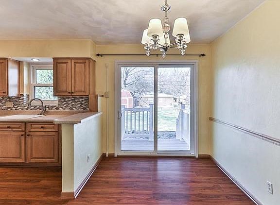 Dining room adjoins the kitchen for great open flow.  Sliding glass door leads to backyard and patio