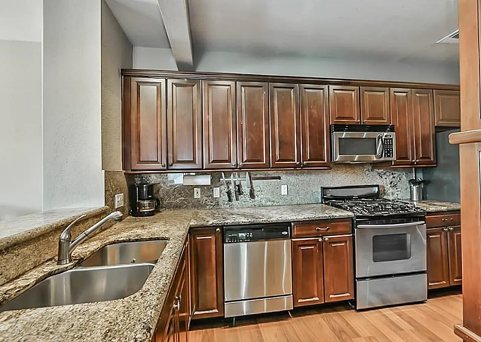 Nicely sized kitchen with abundant cabinet space and stainless steel appliances.
