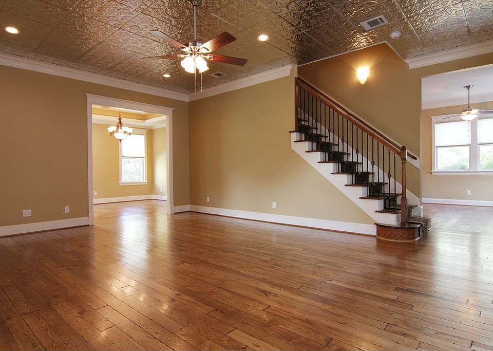 Living area with Hickory Hardwoods and Pressed Tin Ceiling.