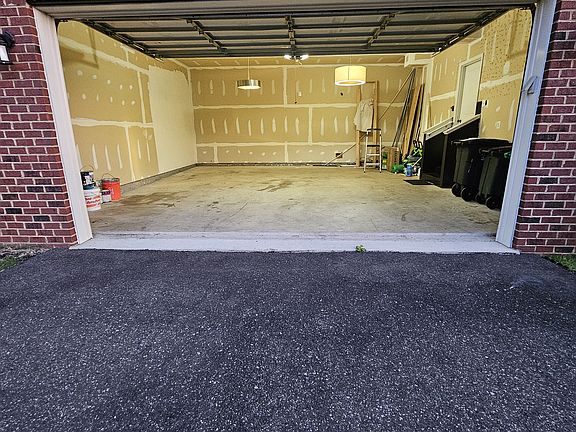 2 Car garage and a driveway that can park additional 4 cars.