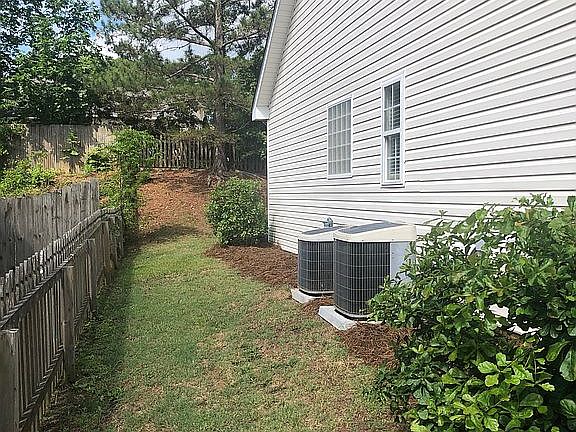 Left side of the house.