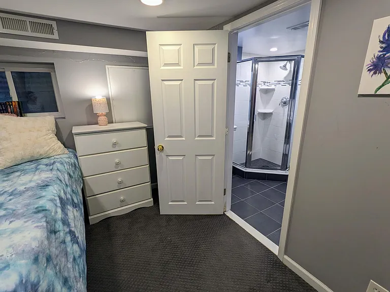 Full bathroom located in the basement connects to third bedroom/office.