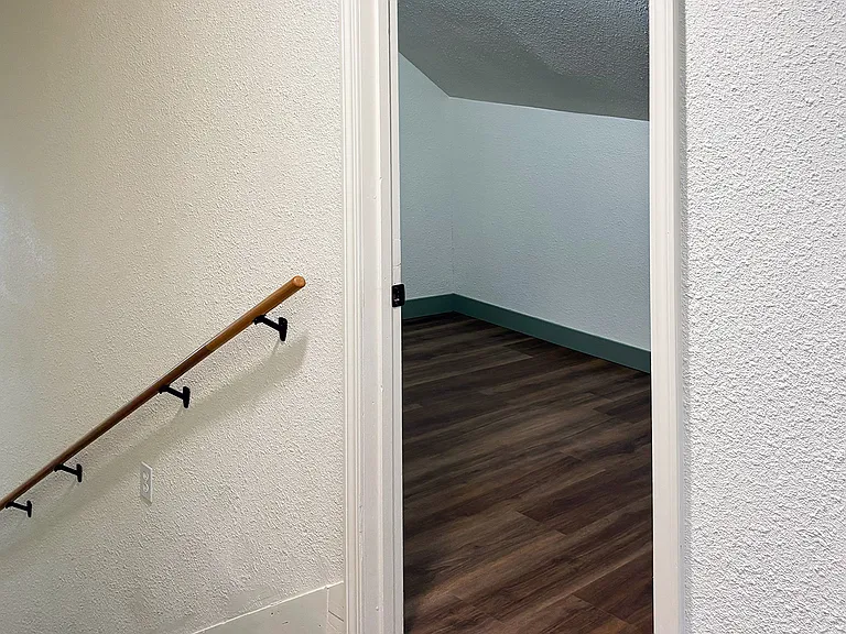 Entry to bonus room for home office, hobby/gaming area, or additional storage.
