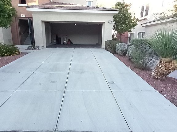 Private driveway and attached garage can easily accommodate 4 vehicles.