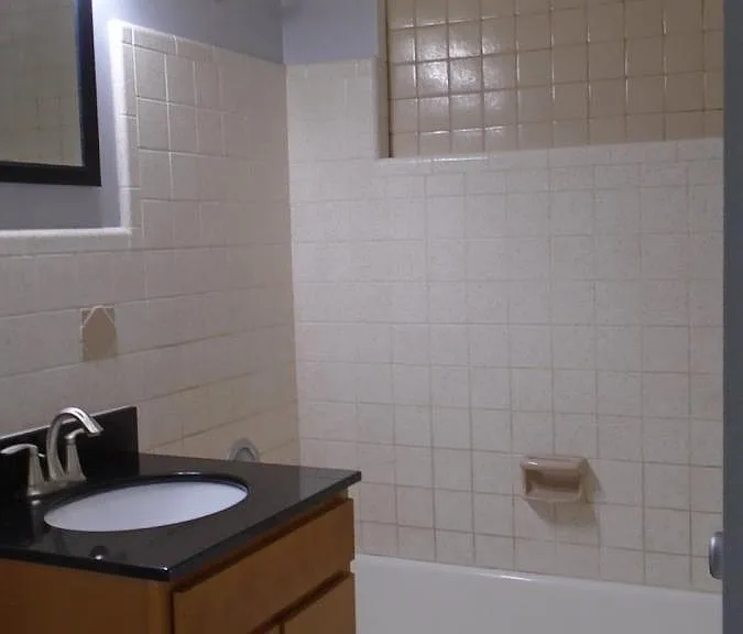 Hallway Bathroom with Marble Top Vanity