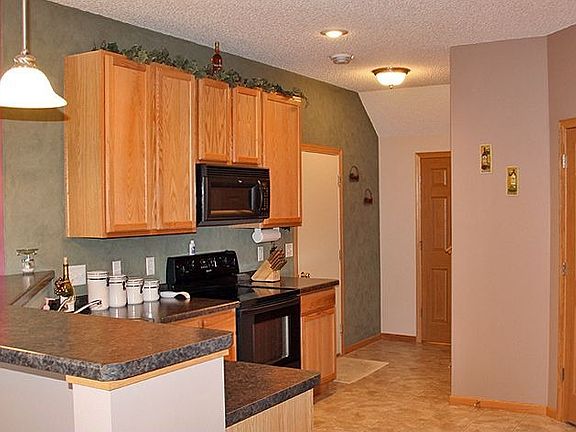 Kitchen.  Note the Breakfast Bar and the large pantry!