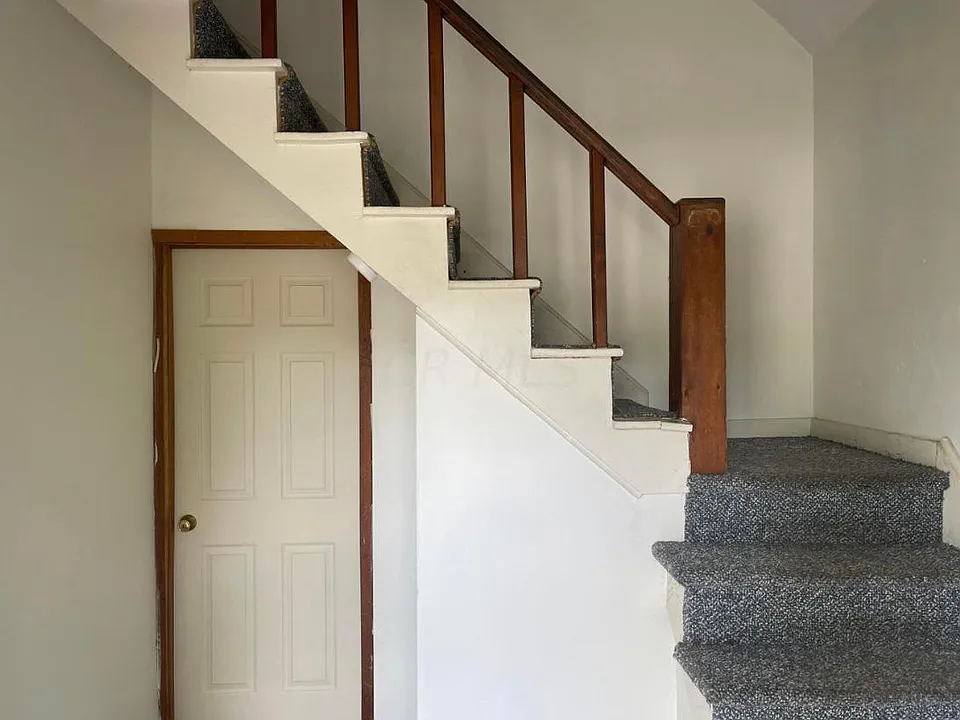 Foyer and Staircase to Upstairs Apartment