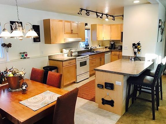 Dining room, and kitchen. Furniture belongs to the tenent, a