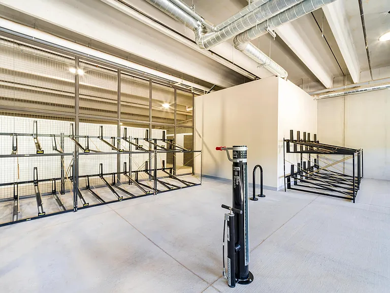 Indoor bike storage with a repair station supports your active lifestyle and offers peace of mind.