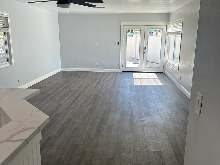 Hallway To Living Room To French Doors To Patio