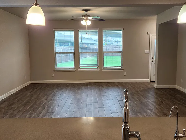 Huge kitchen island overlooking the living room and back yard