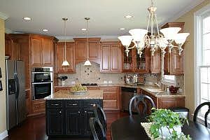 A chef's dream - granite, gas cooktop, raised maple cabinets, hardwood floors