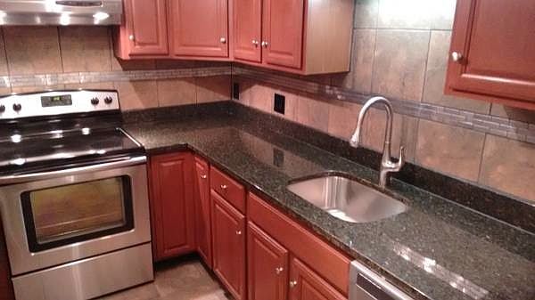 New kitchen-granite counters, SS appliances, tiled backsplas