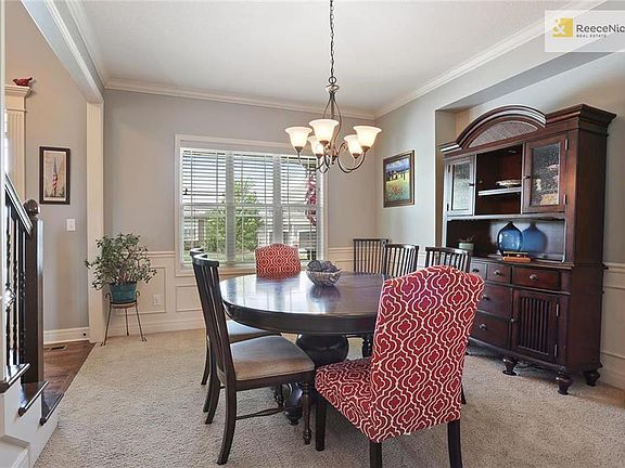 Formal dining room with bump-out for hutch or server.  Wainscoting trims the perimeter of the room.