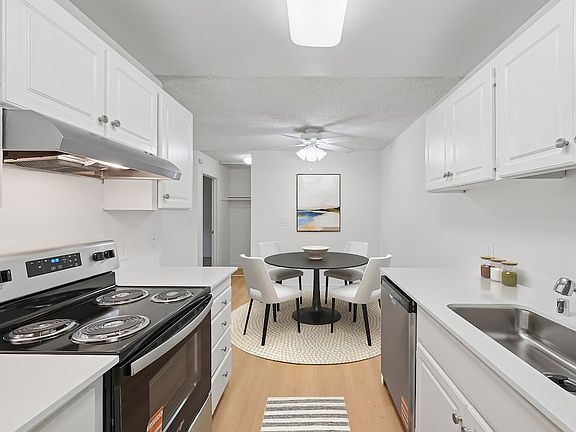 Renovated Package I kitchen and dining area with hard surface flooring