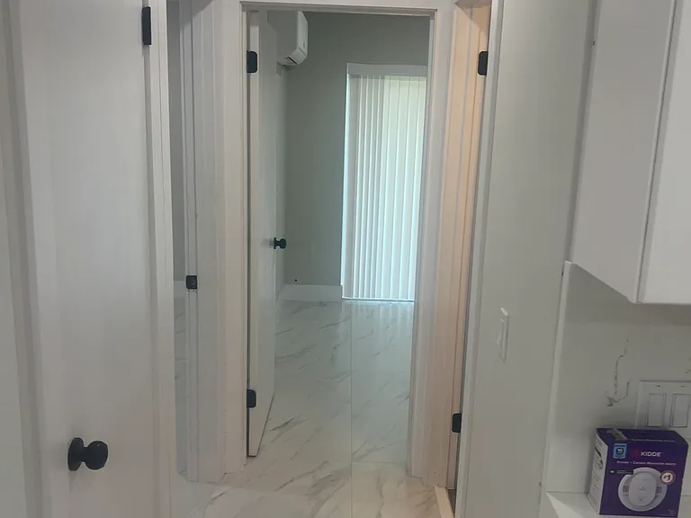 Hallway with closet on left