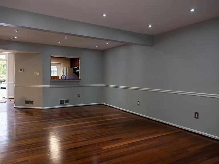 View from the family room to the kitchen and main entrance/foyer.