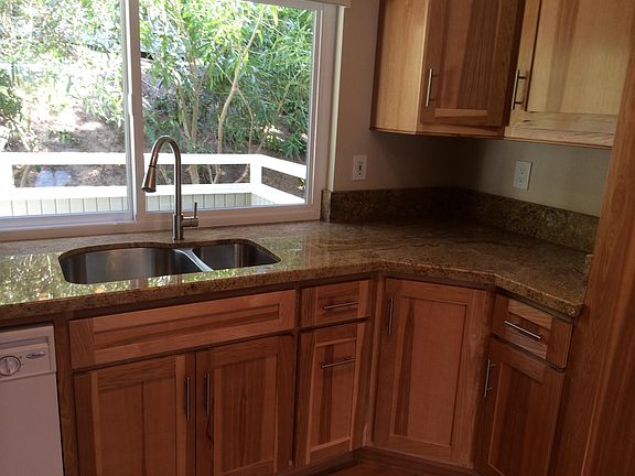 Kitchen with pass-through window to enclosed patio 
