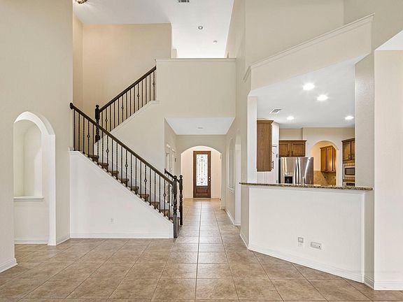 open concept, primary bedroom to left