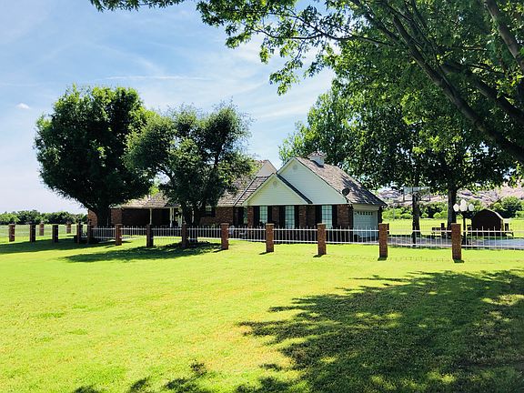 Front yard with mature oaks