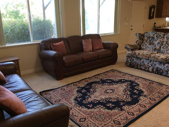 Private backyard and entry way. (Door is on the right.) Great lighting.