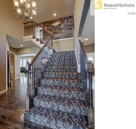 Upgrades include designer carpet on stairs and lighting.