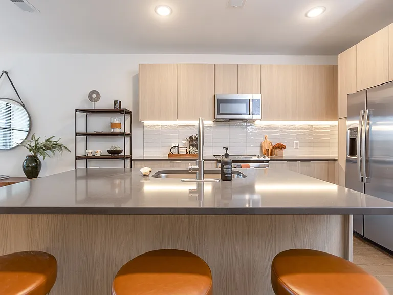 Spacious island and sleek finishes make this kitchen both stylish and functional.