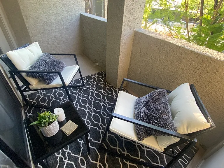 cozy outdoor patio with sitting area