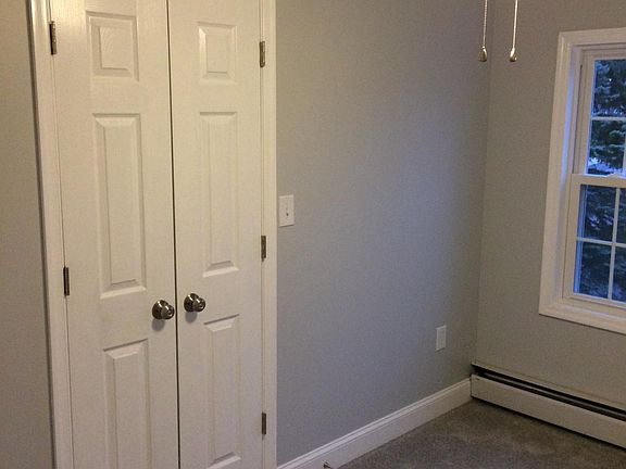 Smaller bedroom - closet and 1st window