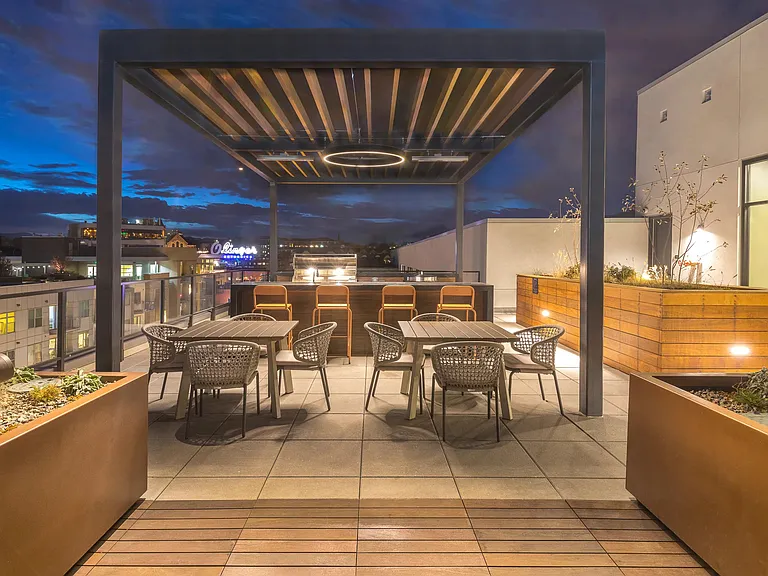 Outdoor dining area and BBQ grilling stations.
