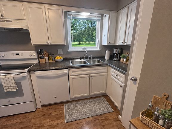 Large window above kitchen sink to view the backyard