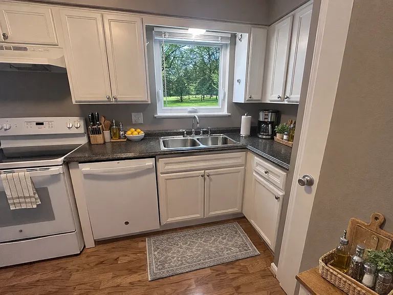 Large window above kitchen sink to view the backyard
