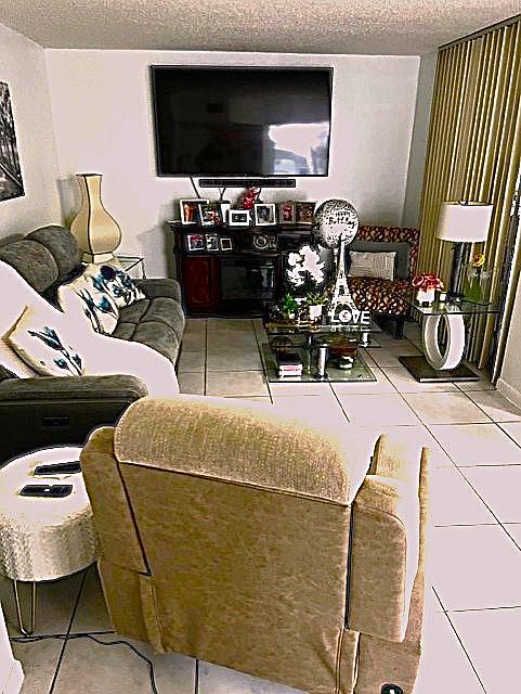Living room with view to screen porch