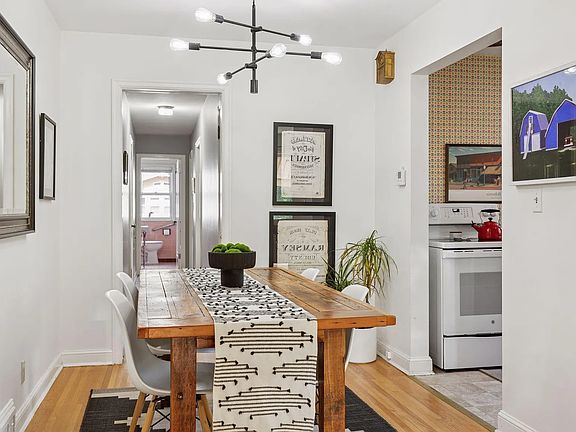 Dining room, which leads to the kitchen and to the back of the home. **All pictures of the first floor are from the other unit, and mirror what this unit will look like when it's done.