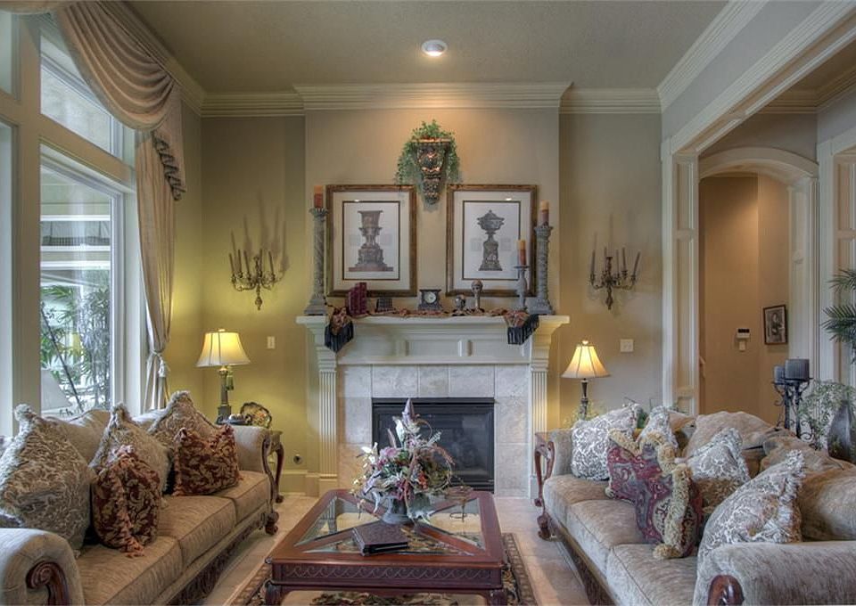 Another view of the formal living room with large windows open to pool area.