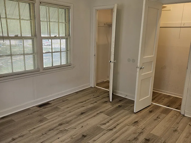 SW bedroom with both closet doors
