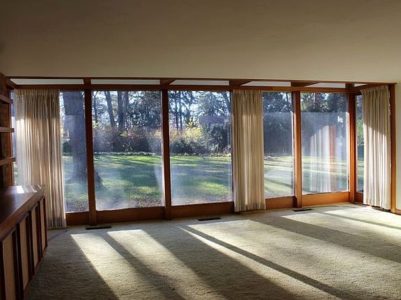 The living room is sure to be your favorite hangout! br /There is a full wall of built-in shelving a