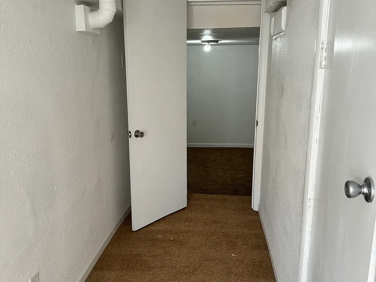 Basement hallway to family room / bonus room / non-conforming 3rd bedroom