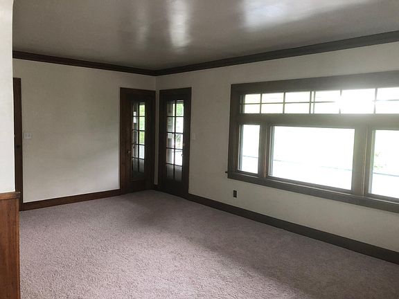 Living room with access to balcony storage closet.