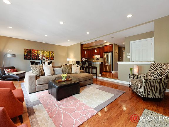 Open Living, Dining & Kitchen with Hardwood Floors