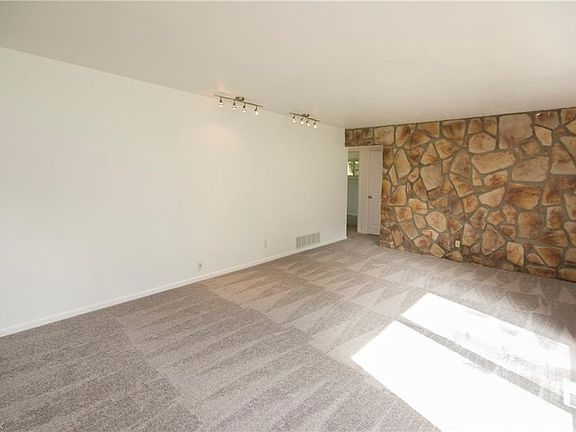 Stone wall in the family room makes a great feature!