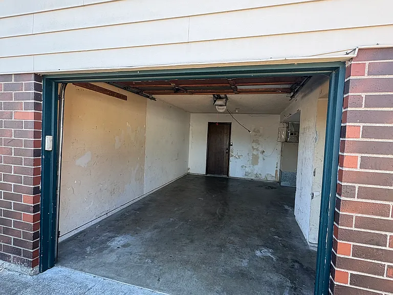 Attached one car garage with garage door opener