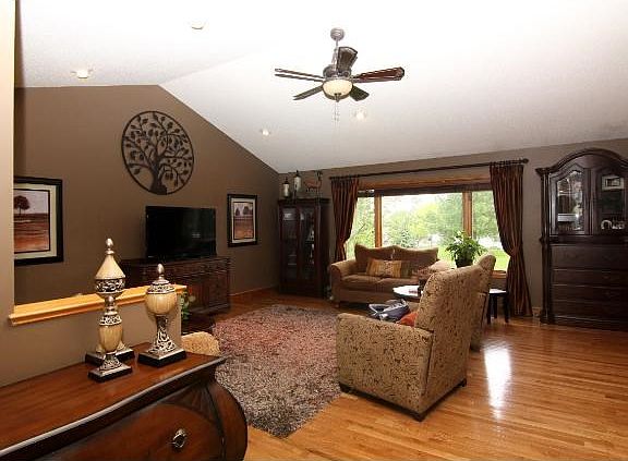 With plenty of space to gather and views overlooking the lush and green back yard, it's a gracious and comfortable space for family and friends to congregate.