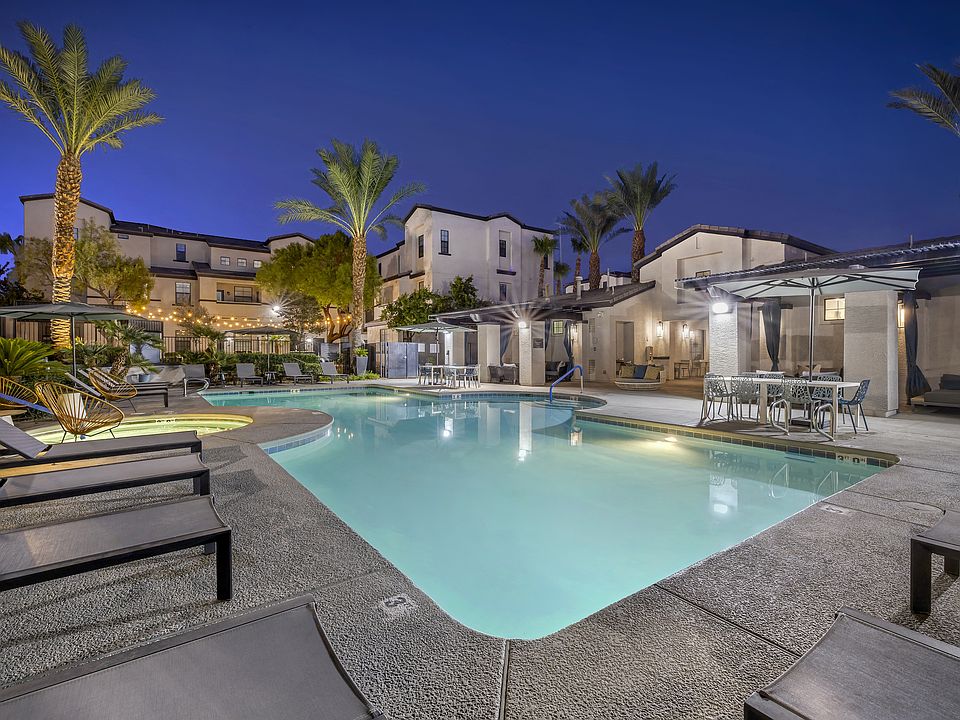 As the sun sets and twilight takes over, the pool transforms into a serene oasis, with ambient lighting enhancing the luxurious feel of the surroundings.