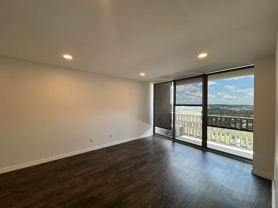 Updated living/dining room features dimmable, efficient LED lighting, new roller shades, and luxury vinyl flooring.