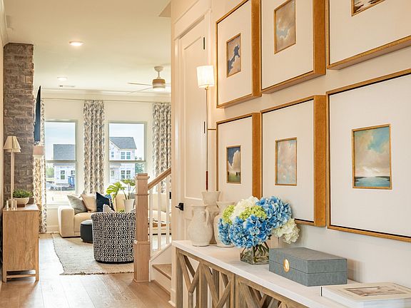 Expertly designed entry leading to great room after passing bedroom and formal living room