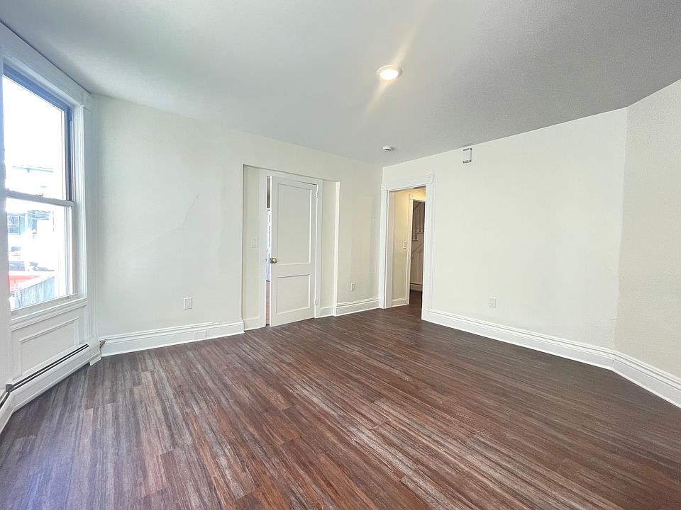 Living Room- showing master bedroom door and front door entrance