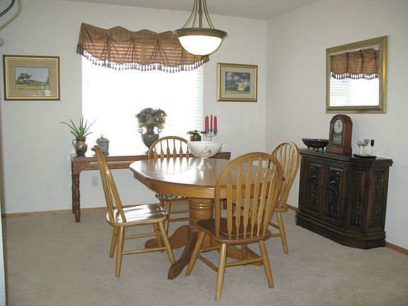 Spacious dining room adjacent to both formal living room and kitchen 