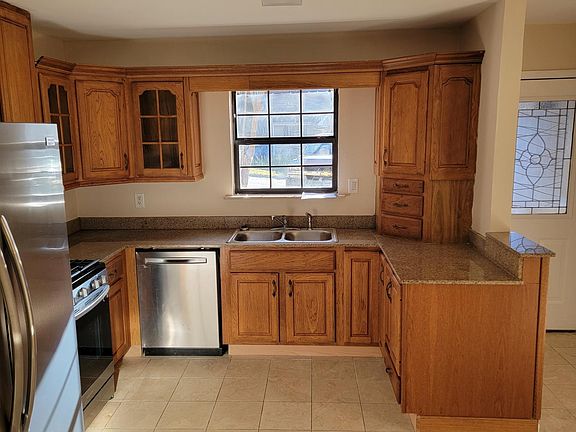 Kitchen cabinets hardwood, all new appliances, refrigerator. gas stove and dishwasher.