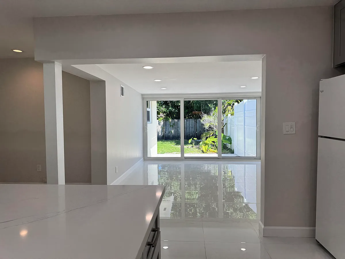 Another view of the triple wide, hurricane proof, sliding door to the back patio and backyard. - 11419 SW 81st Rd